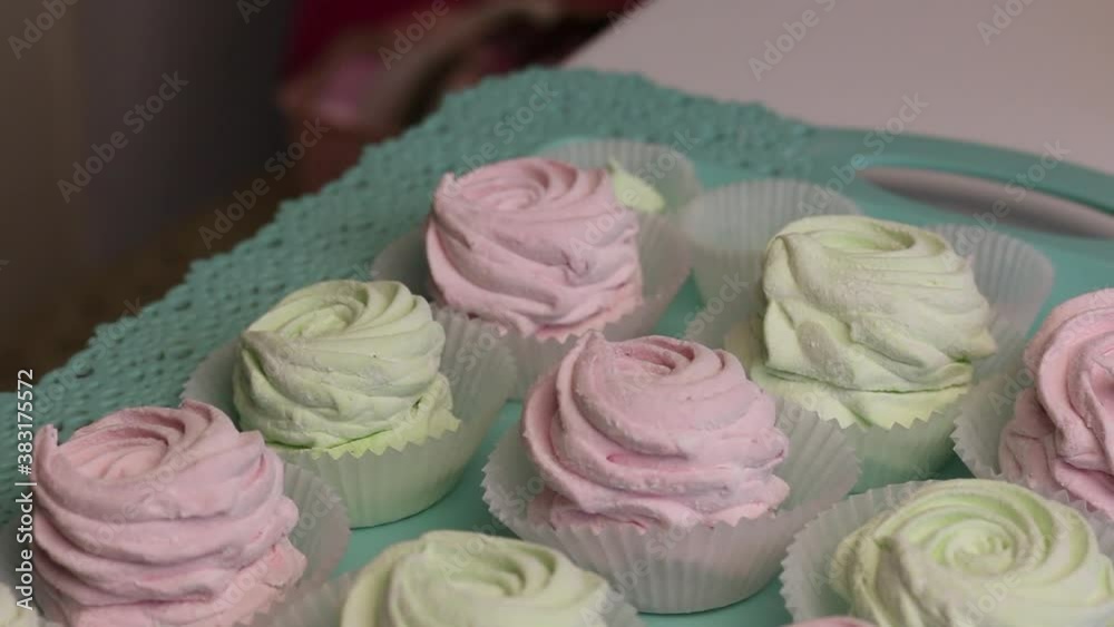 Delicate pink and light green zephyr. Lies in cardboard boxes. Nearby accessories for packaging. Delicate pink and light green zephyr. Lies in cardboard boxes. Nearby accessories for packaging.