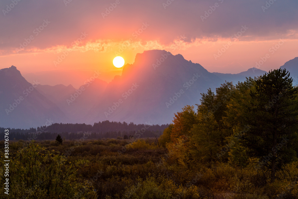 Landscape view of a beautiful sunset in Grand Teton National Park as seen from Willow Flats Overlook.