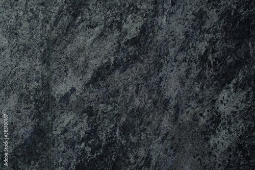 A photo of a hundred and fifty shades of black and a little gray. The surface of the marble slab.