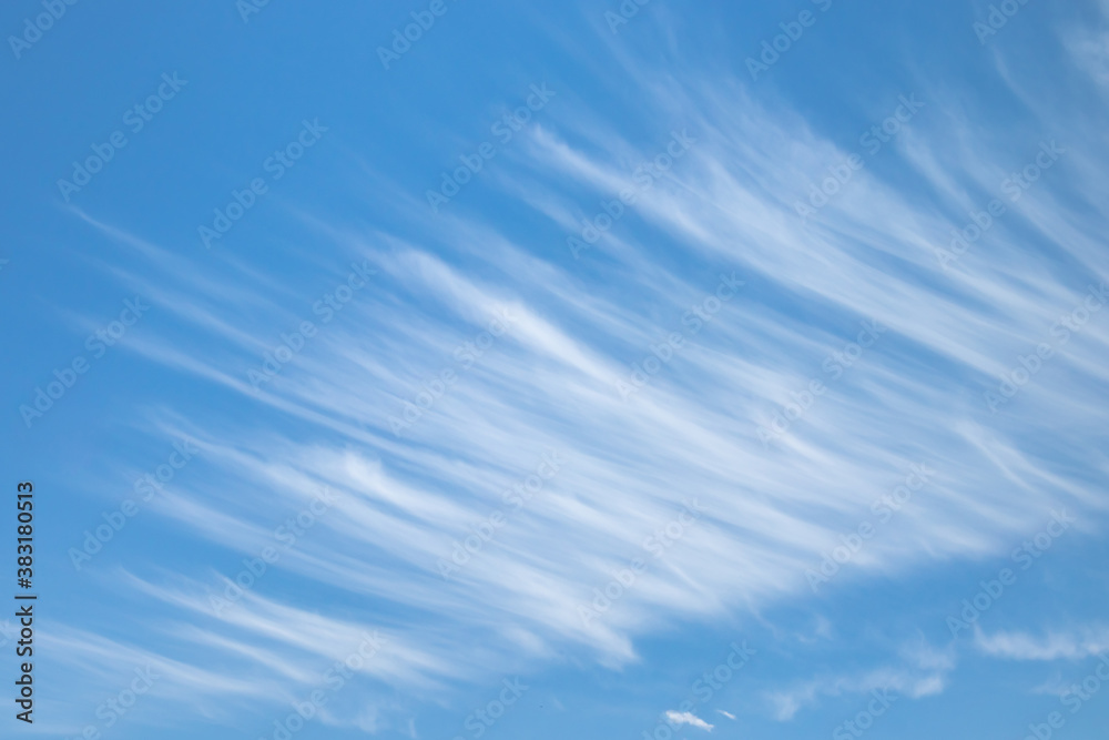 Thin wispy white clouds texture in the blue sky