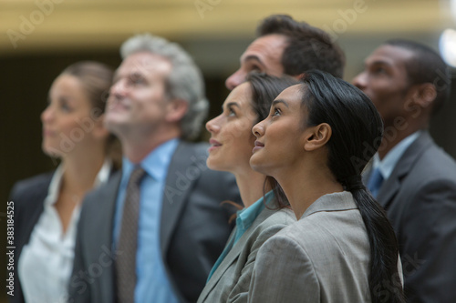 Billede på lærred Corporate business people looking up in anticipation