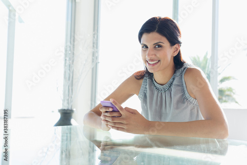 Portrait smiling woman using smart phone