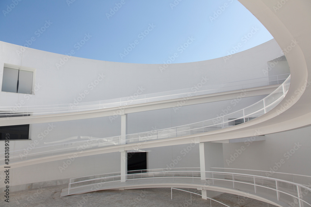 Winding ramps in modern building courtyard Stock Photo | Adobe Stock
