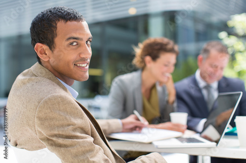 Valokuva Portrait confident businessman working at table outdoors
