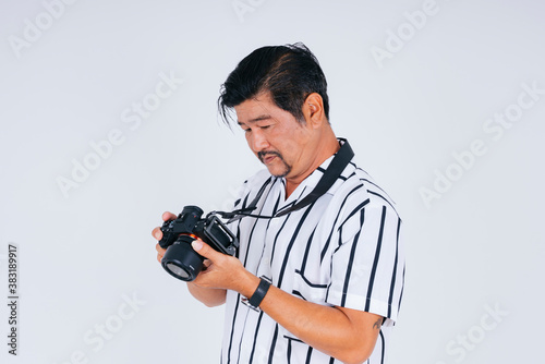 Asian photographer with camera isolate on white background.