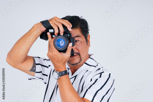 Asian photographer with camera isolate on white background.