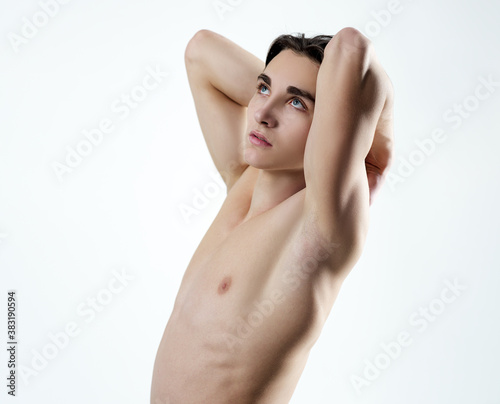 Young man with muscular body and bare torso. photo