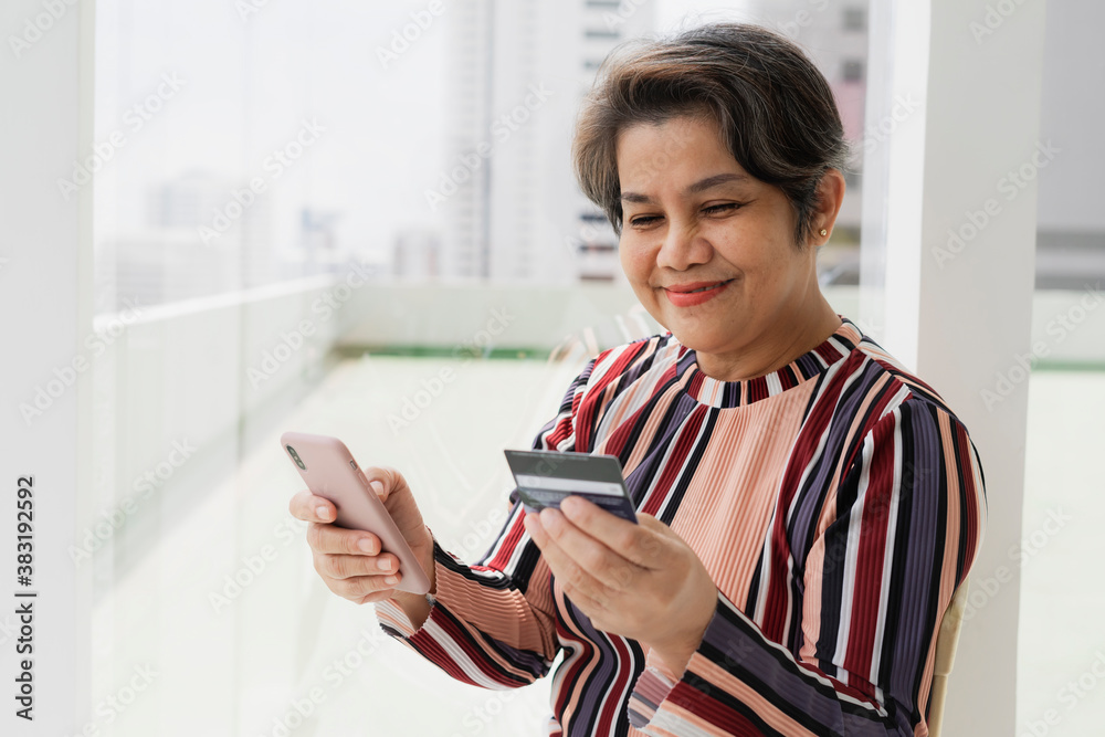 Senior woman shopping with smartphone and credit card. Senior woman shopping with smartphone and credit card.