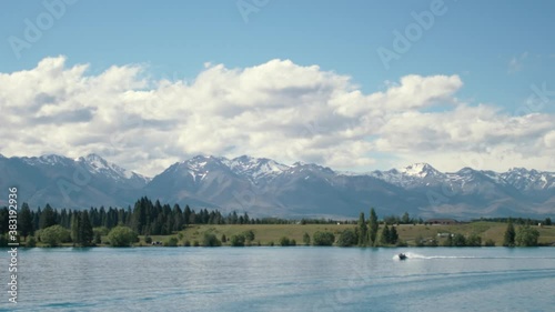 Speedboat on picturesque mountain lake