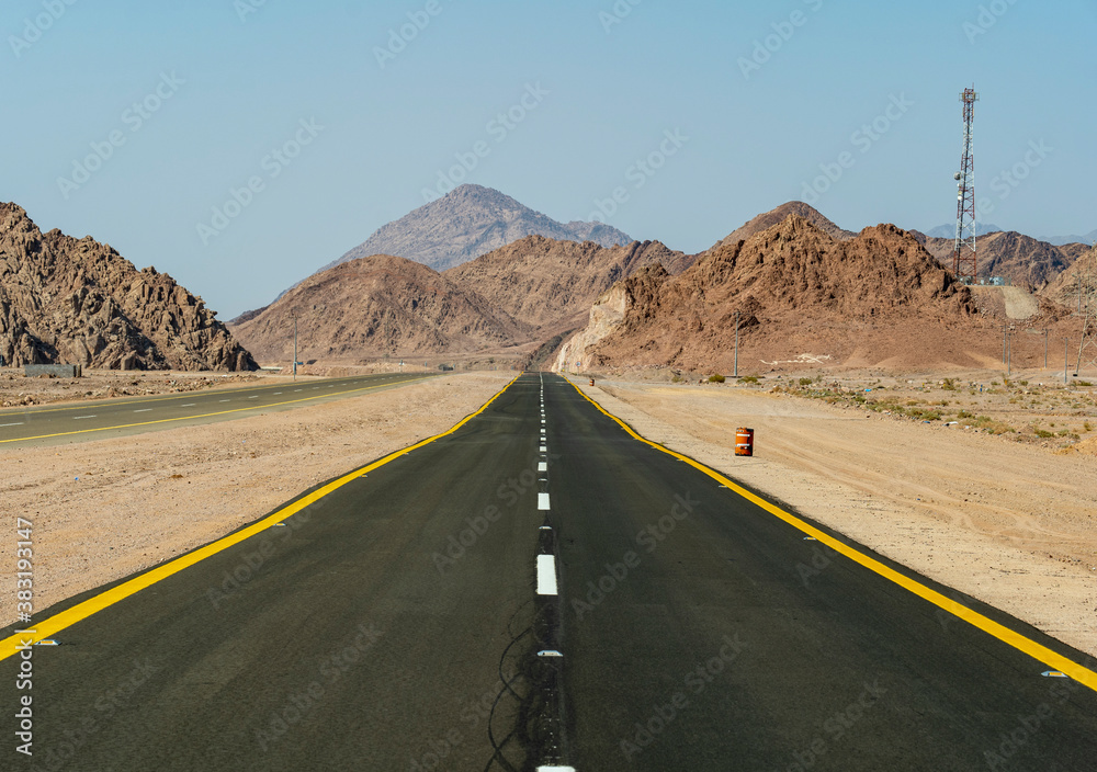 Desert road in remote rural area of Tabuk in north western Saudi Arabia Desert road in remote rural area of Tabuk in north western Saudi Arabia
