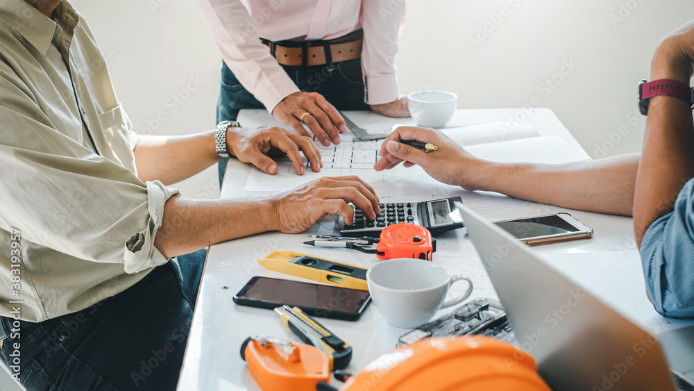 Team of architects and engineers to design and draft a construction ...