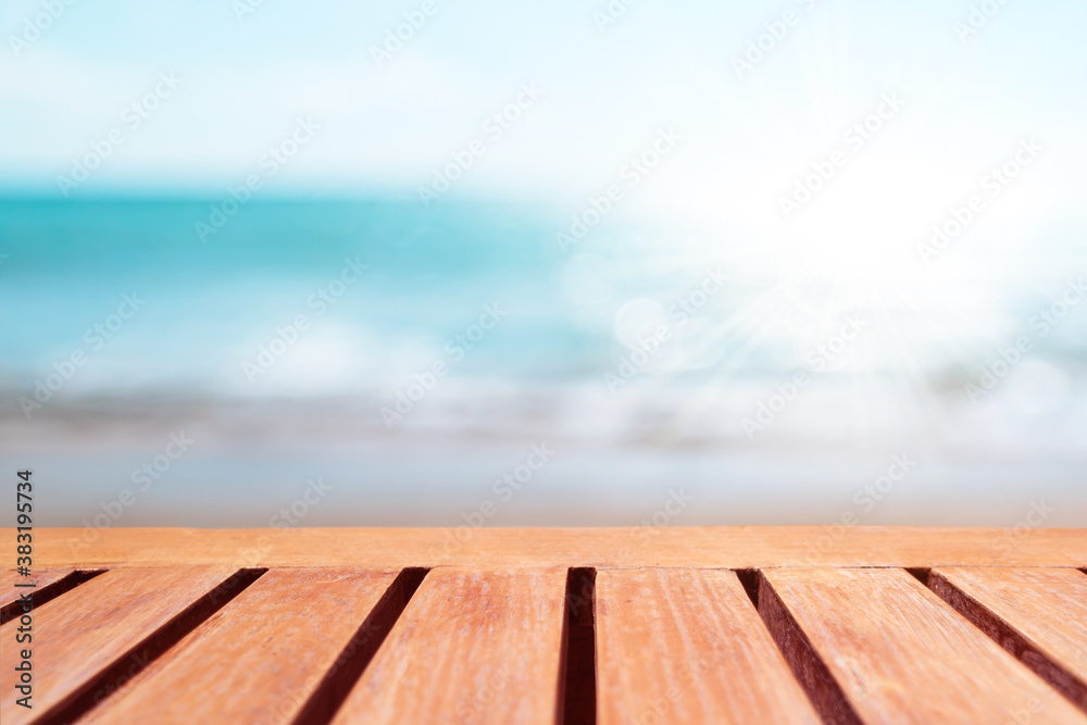Selective focus of old wood table with beautiful beach background for display your product. Selective focus of old wood table with beautiful beach background for display your product.