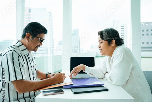 Asian business people working with partner together in office room.