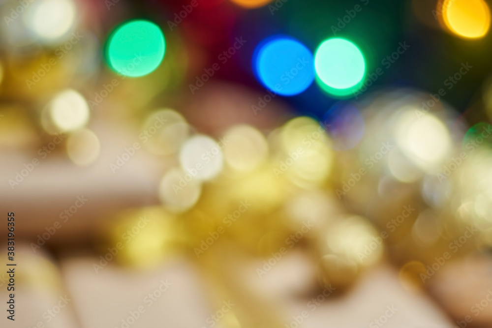 Blurred Christmas background. Defocused image for background usage. Christmas decorations and gift boxes. Gaussian blur filter applied Blurred Christmas background. Defocused image for background usage. Christmas decorations and gift boxes. Gaussian blur filter applied