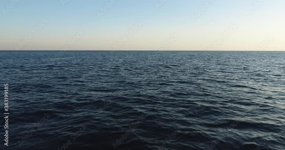 Calm sea horison background texture with small wave and clear sky / aerial fast speed drone shot at summer morning view Calm sea horison background texture with small wave and clear sky / aerial fast speed drone shot at summer morning view