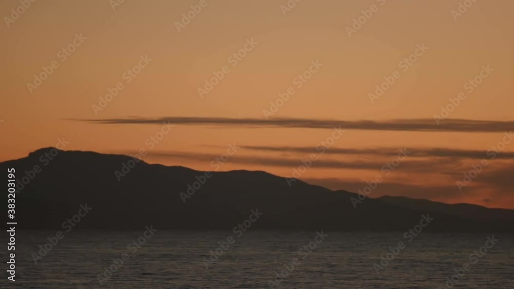 Mountains going in the sea. French Riviera, France. Pan on Antibes, city on water. Mountains going in the sea. French Riviera, France. Pan on Antibes, city on water.
