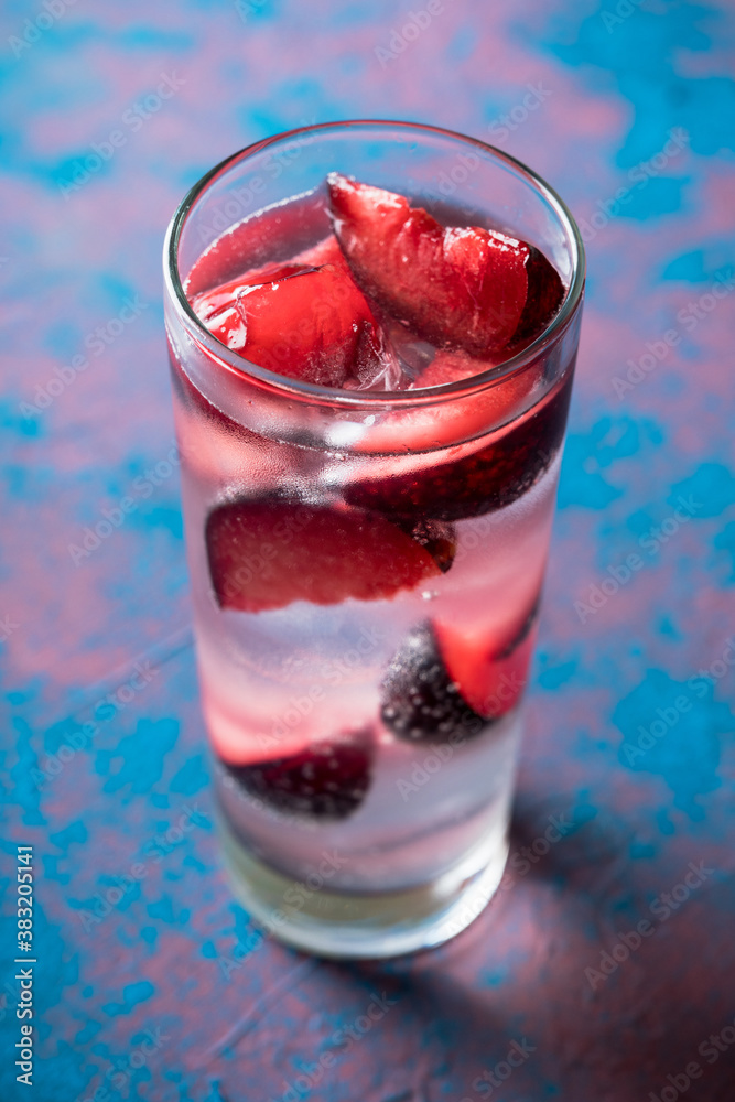 Autumn cocktail with red plums. Selective focus. Shallow depth of field. Autumn cocktail with red plums. Selective focus. Shallow depth of field.