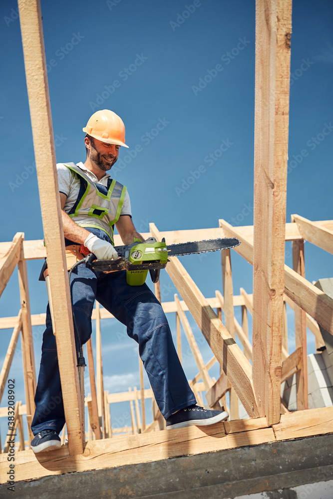Cheerful male person working on the building Cheerful male person working on the building
