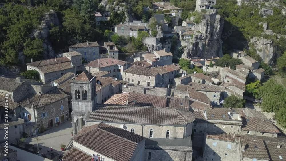 Low rotating aerial around St Joseph Church in medieval French village Low rotating aerial around St Joseph Church in medieval French village