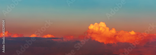 Dramatic sky over blue sea at sunset. Background of dark clouds before a thunderstorm