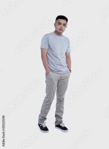 Young handsome man was posing wearing heather grey t-shirt short sleeve with mockup concept