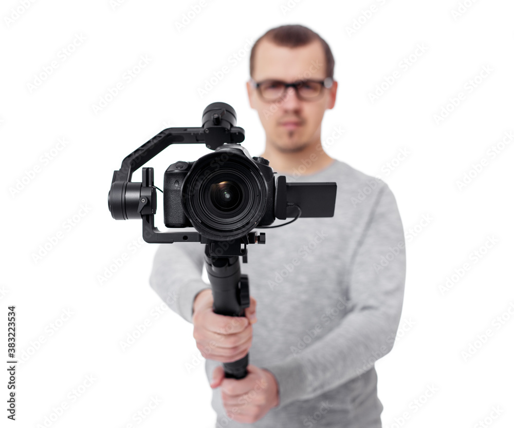dslr camera on 3-axis gimbal stabilizer in videographer hands isolated on white