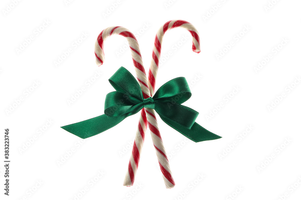 Green gift bow with candy canes isolated on white background Green gift bow with candy canes isolated on white background