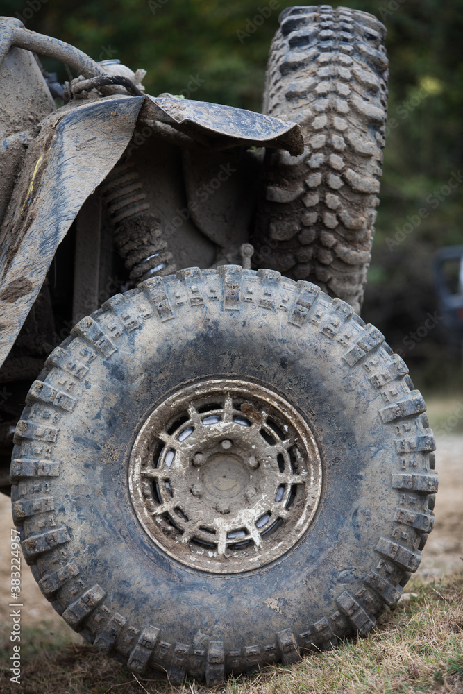 Muddy off road tire on a 4x4 car Muddy off road tire on a 4x4 car