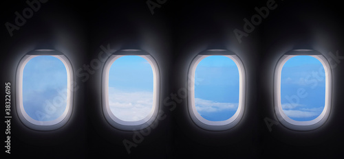 four airplane windows open white window shutter wide with blue sky view. plane portholes usable for banners, brochures in tourism theme. traveling by air concept