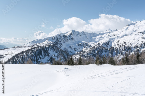 View of the snow-capped mountain peaks of the Dolomites against the sky. Concept background, landscape. © Chetgal 