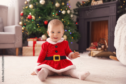 Cute little baby in Santa c...