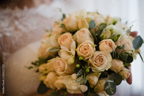 bride holding a bouquet of roses  bridal bouquet of white roses  wedding day