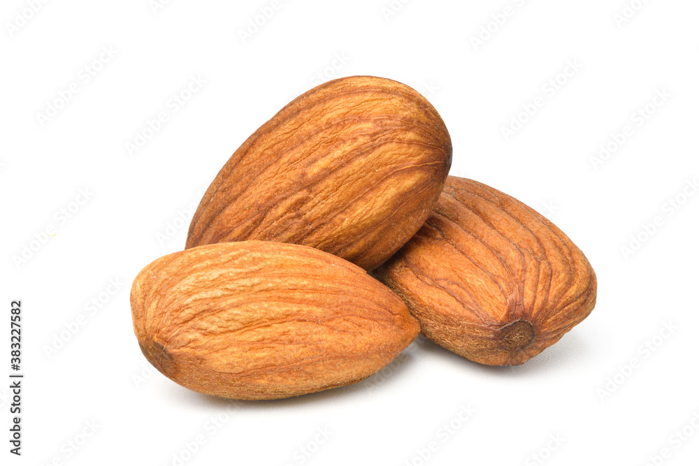 Close-up of Three Almond seeds isolated on white background. Clipping path. Close-up of Three Almond seeds isolated on white background. Clipping path.