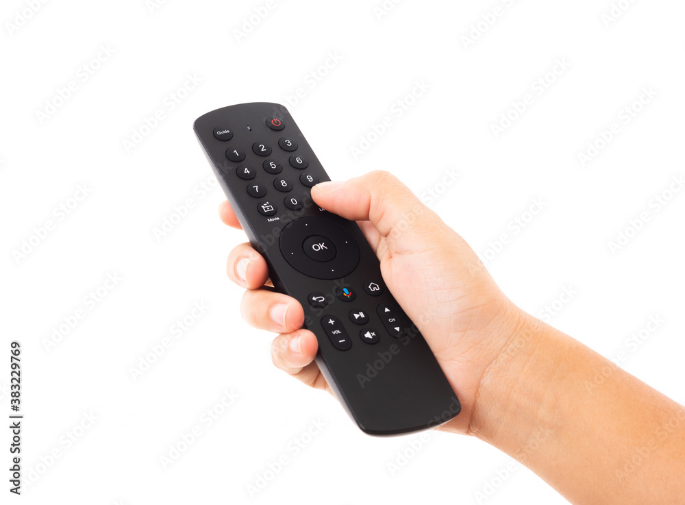 Hand holding television and audio remote control panel, studio shot isolated on over white background, Television wall broadcasting concept Hand holding television and audio remote control panel, studio shot isolated on over white background, Television wall broadcasting concept