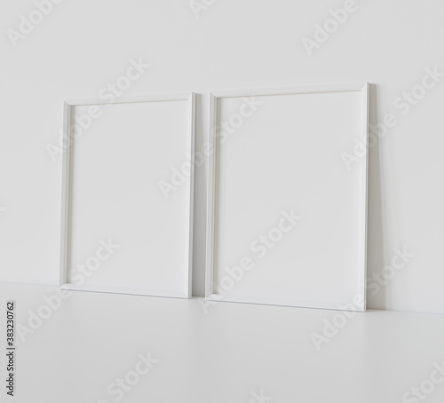 Two white frames leaning on white floor in interior mockup. Template of pictures framed on a wall 3D rendering