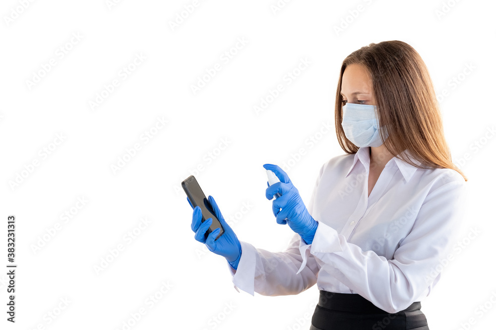 Hygiene protection. Covid-19 prevention. Office work quarantine. Woman in protective mask gloves sanitizing mobile phone isolated on white copy space. Advertising background Hygiene protection. Covid-19 prevention. Office work quarantine. Woman in protective mask gloves sanitizing mobile phone isolated on white copy space. Advertising background