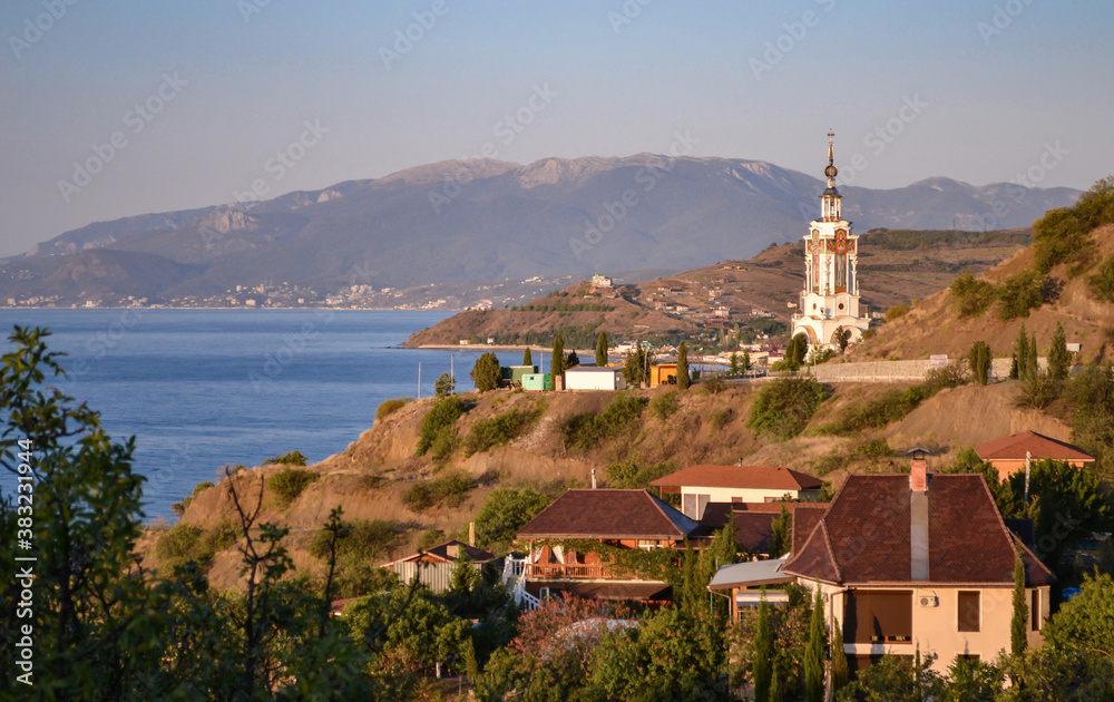 Dawn on the coast of Crimea. Lighthouse Church of St. Nicholas the Wonderworker