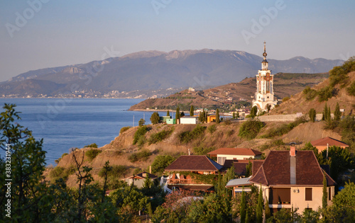 Dawn on the coast of Crimea. Lighthouse Church of St. Nicholas the Wonderworker