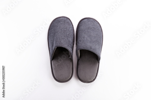 Pair of blank soft gray home slippers, design mockup. Hotel bath slippers top view isolated on white background. Clear warm domestic sandal or sneakers. Bed shoes accessory footwear.