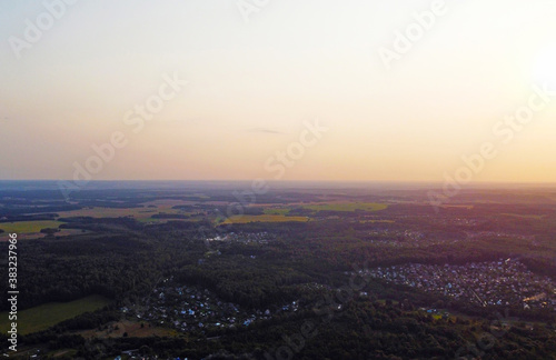 Beautiful top view of a forest landscape with green trees near the suburb
