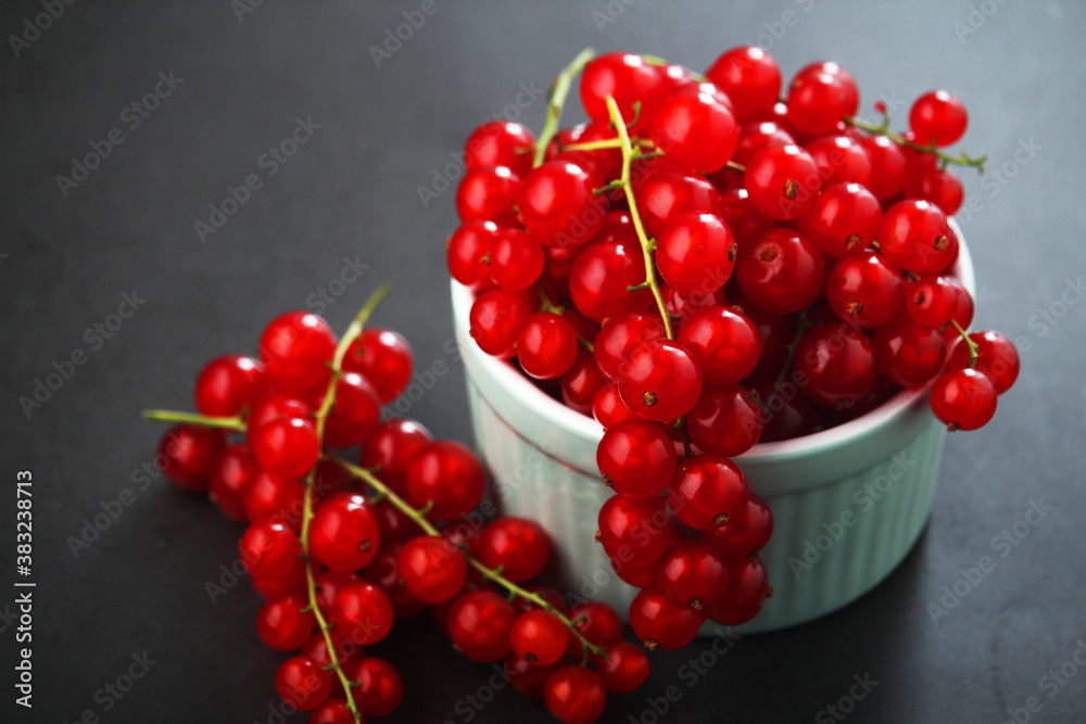 A ceramic bowl with red currant berries A ceramic bowl with red currant berries