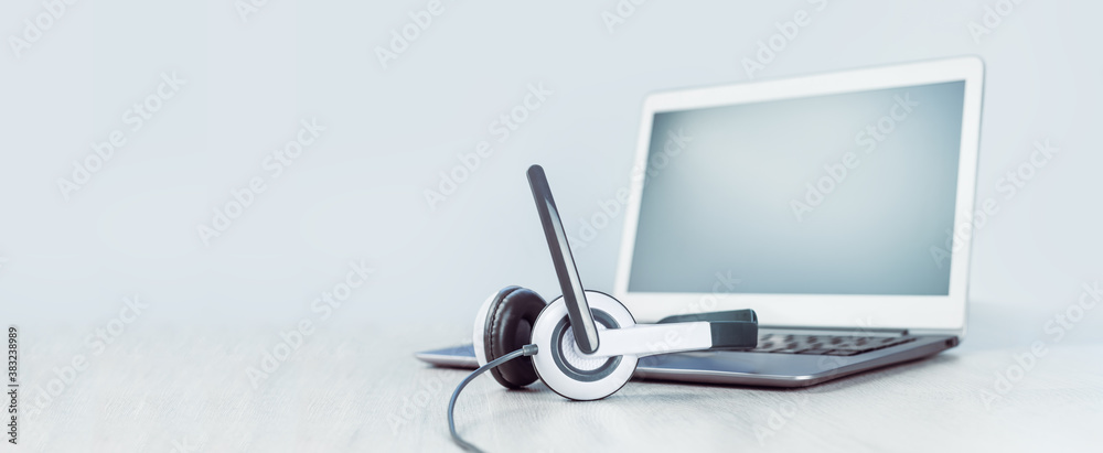 Laptop. Mockup screen and headphones on grey desk and plain background  banner. Distant learning. working from home, online courses or support  minimal concept. Helpdesk or call center headset Stock Photo | Adobe