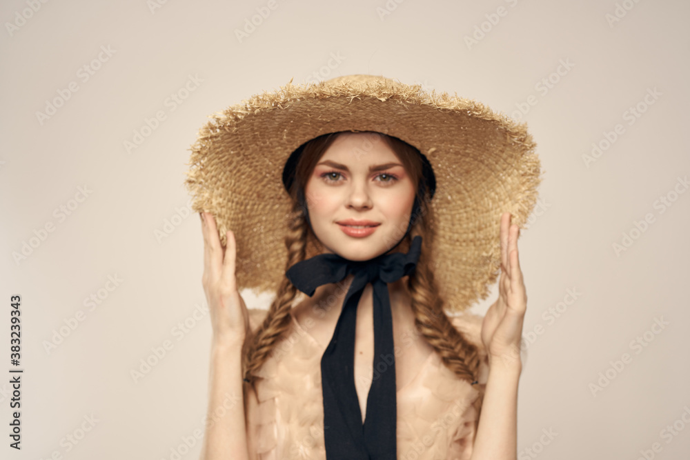 cute girl in straw hat with black ribbon and dress on beige background cropped view cute girl in straw hat with black ribbon and dress on beige background cropped view