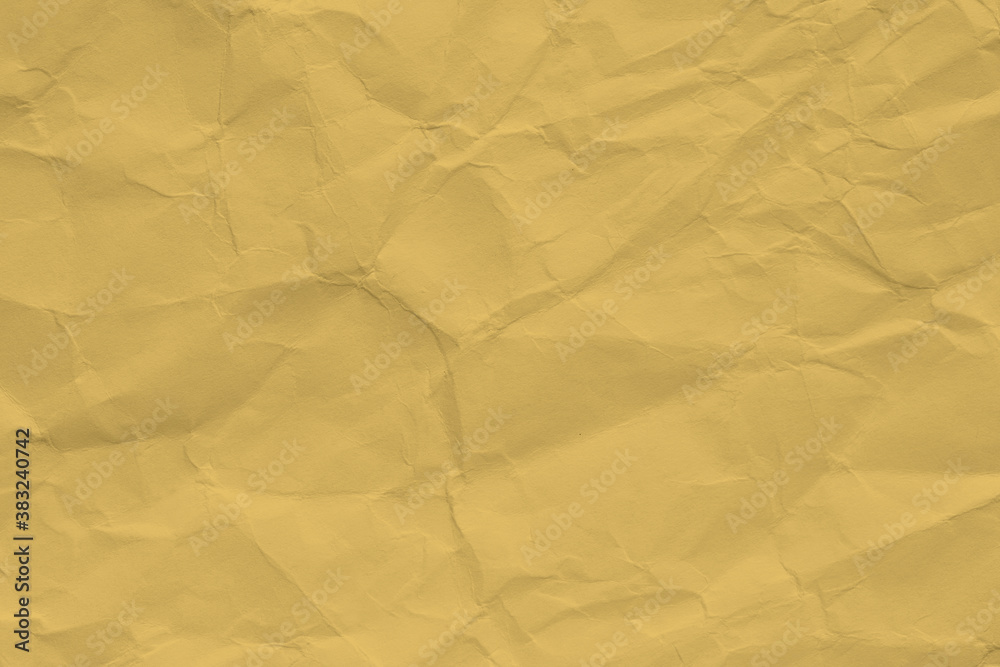 Obraz premium Paper beige color aged and wrinkled. Background of brown color with kinks and fraying.