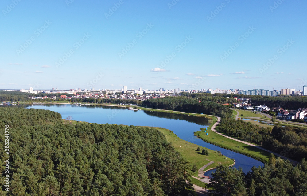 Top view of a beautiful city summer park with a river