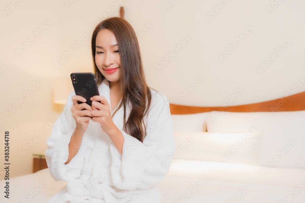 Portrait beautiful young asian woman use smart mobile phone on bed Portrait beautiful young asian woman use smart mobile phone on bed