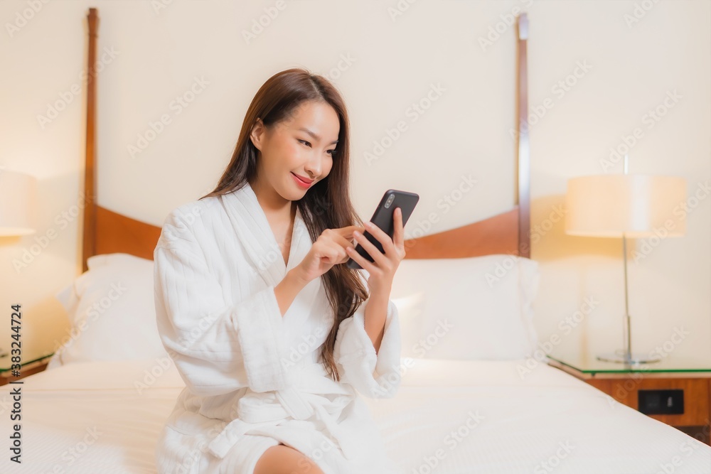 Portrait beautiful young asian woman use smart mobile phone on bed Portrait beautiful young asian woman use smart mobile phone on bed