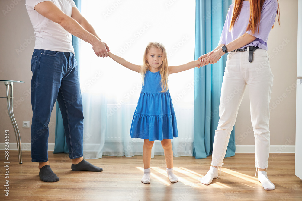 Naklejka premium little daughter girl doesn't want parents to be divorced, sad girl listen to quarrels of parents, want happy family
