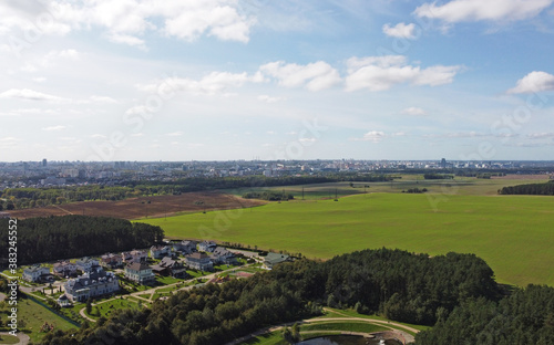 Top view of a green field outside the city