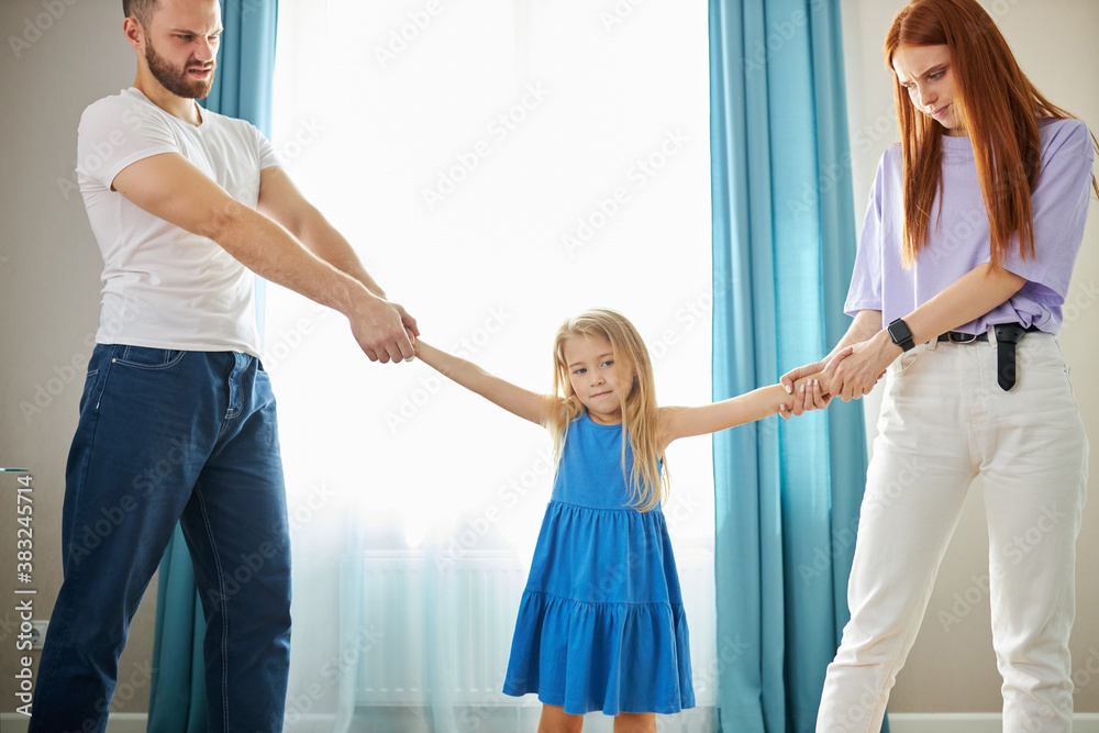 divorced caucasian parents arguing about child custody, divide property and child. parental fmaily quarrels concept divorced caucasian parents arguing about child custody, divide property and child. parental fmaily quarrels concept